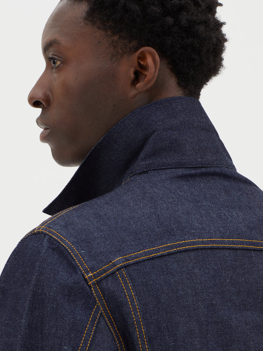 TAILORED DENIM TRUCKER JACKET IN RAW INDIGO DENIM