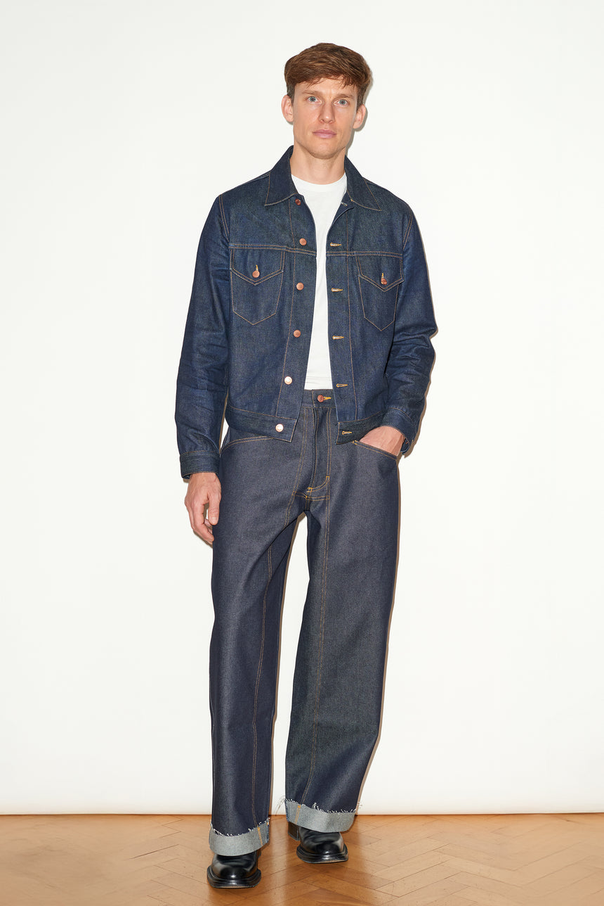 TAILORED DENIM TRUCKER JACKET IN RAW INDIGO DENIM