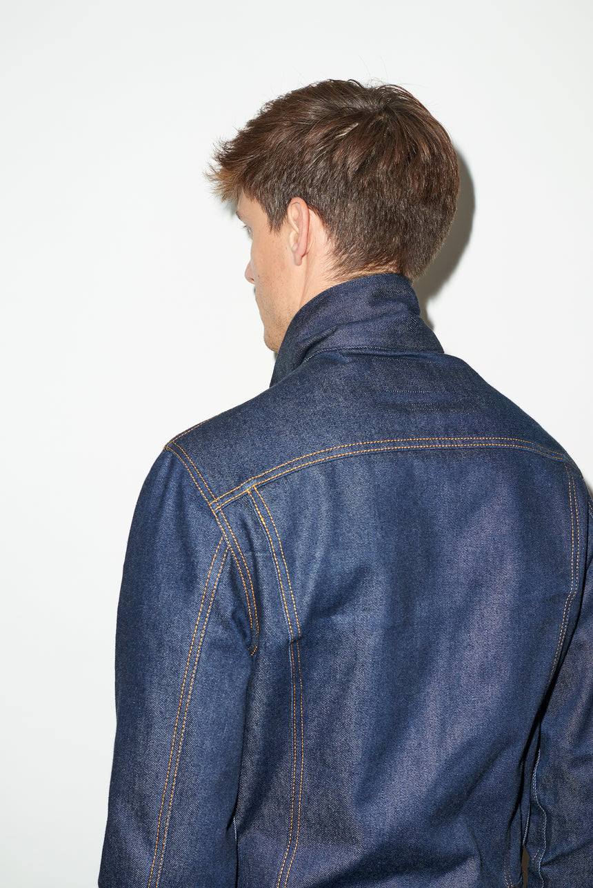 TAILORED DENIM TRUCKER JACKET IN RAW INDIGO DENIM