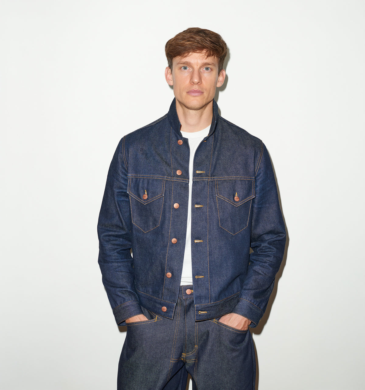 TAILORED DENIM TRUCKER JACKET IN RAW INDIGO DENIM