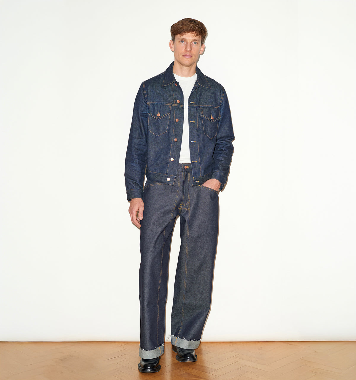 TAILORED DENIM TRUCKER JACKET IN RAW INDIGO DENIM