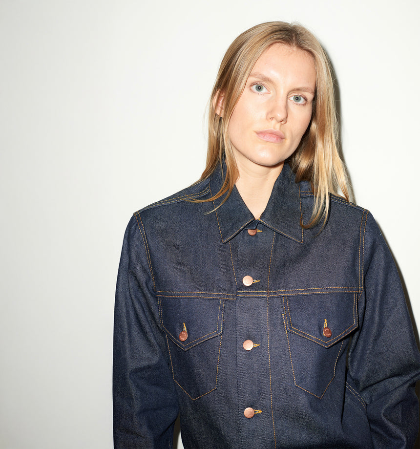TAILORED DENIM TRUCKER JACKET IN RAW INDIGO DENIM