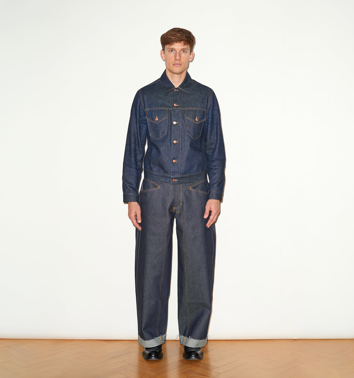 TAILORED DENIM TRUCKER JACKET IN RAW INDIGO DENIM