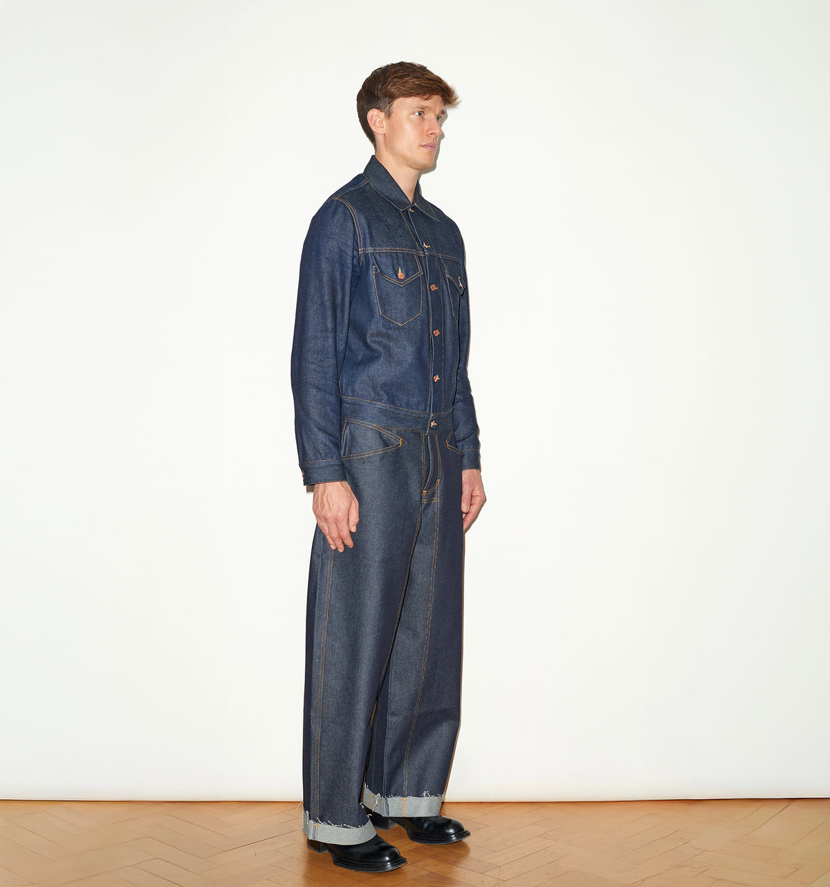 TAILORED DENIM TRUCKER JACKET IN RAW INDIGO DENIM